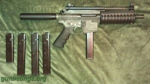 Pistols Bushmaster 9mm AR Pistol With Extras.