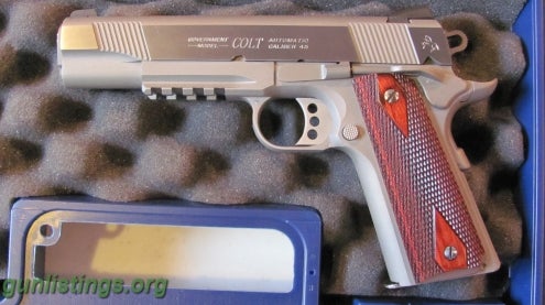 Pistols Colt Stainless 45 Rail Gun.