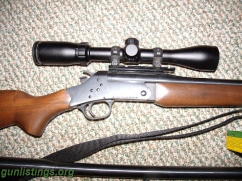 Rifles ROSSI 243 WITH A 12 GAUGE BARREL,AMMO AND SCOPE