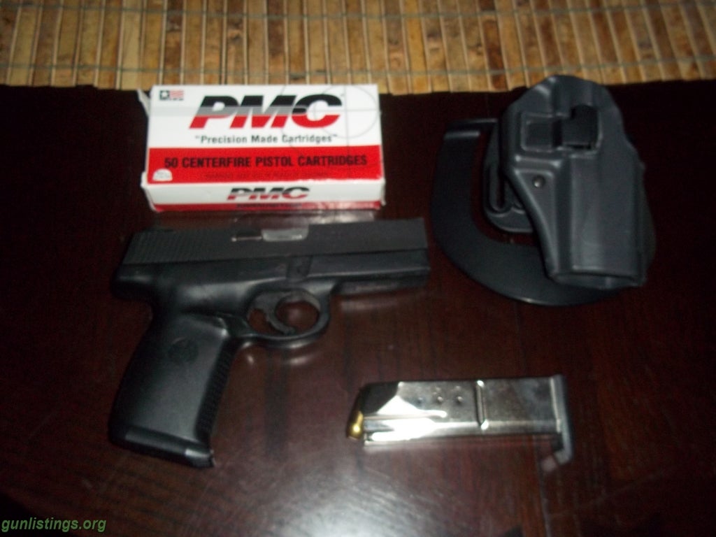 Pistols S&W .40 Pistol And Blackhawk Holster