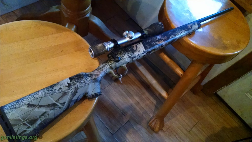 Gunlistings.org - Rifles Savage Axis 223 With Camo Stock And Scope