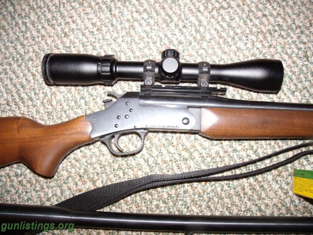 Rifles ROSSI 243 WITH A 12 GAUGE BARREL,AMMO AND SCOPE