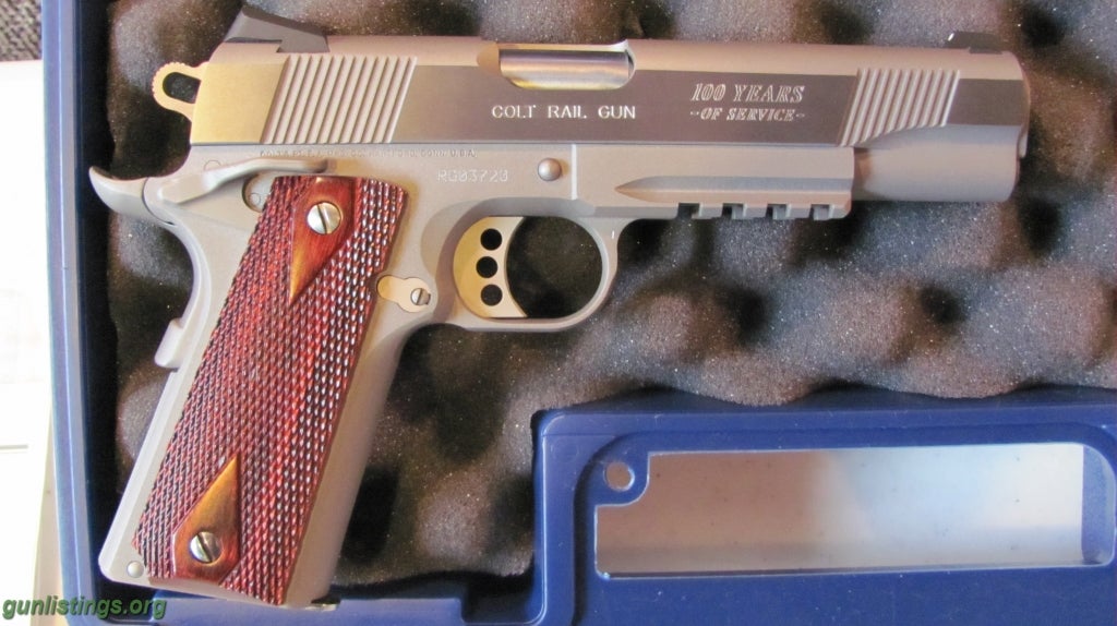 Pistols Colt Stainless 45 Rail Gun.